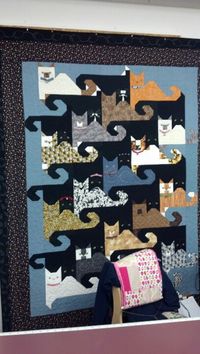 Another tessellating cat quilt - love the little kitty faces