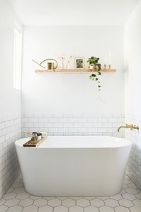 Bath Room, Freestanding Tub, and Subway Tile Wall Bathrooms We Love: Beauty Vlogger Kristin Johns Showcases Her Glistening Bathroom in Los Angeles - Photo 4 of 9 -