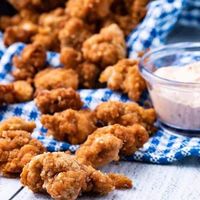 You’ve got to try this Healthy Air Fryer Popcorn Chicken! Made with air fried chicken thighs. Tender, crispy pieces of chicken – first marinated to tenderize, then lightly battered in a spicy, salty flour mix, then air fried to perfection! This popcorn chicken makes a great appetizer, a fabulous fried chicken salad or even by itself. I bet you can’t eat just one! Now you might be tempted to just eat the air fryer popcorn chicken by itself but really try to incorporate a salad with it.