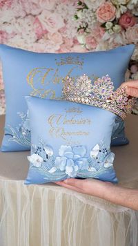 The personalized Dusty Blue Gold Quinceañera Tiara Pillow is an exquisite and elegant accessory designed to hold and showcase the quinceañera tiara. The Quinceañera Tiara Pillow in Baby Blue  serves as a cherished keepsake for the Quinceañera, symbolizing her transition into womanhood and adding a touch of grandeur to her special day. quinceañera theme, quinceañera decoration, quinceañera ideas, sweet 15 party ideas, quinceañera 2024, sweet 16 ideas, quinceanera decor