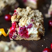 Cranberry Cream Cheese Crumble Bars. Chewy crispy sweet and tart these bars are bursting with fresh cranberries and have a layer of cream cheese too! Can be gluten free! #glutenfree #recipes