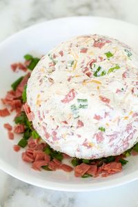 Looking for a crowd-pleasing appetizer? This chipped beef cheese ball is a deliciously savory blend of creamy cheese, tangy seasonings, and salty beef, perfect for any gathering! Easy to make and always a hit! Try serving this dried beef cheese ball with crackers, vegetables, or toast. 