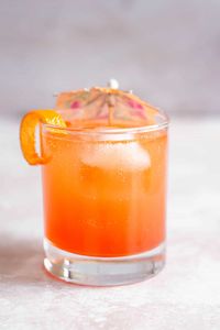 aperol ginger beer cocktail with umbrella.