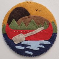 This medallion / ornament was designed to capture the Muskoka spirit and features a canoe and paddle against a Muskoka lake landscape.  This item was handmade in Muskoka, Canada. Please allow for slight variations as this item is handmade and stitched. Size: 3.5" diameter. Please message if you would like a larger/smaller size so this can be discussed.  This medallion / ornament is not stuffed and lays flat.  Please note that colours may vary slightly due to the nature of the felt.  This item is