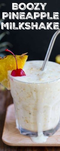 Fresh pineapple milkshake with coconut sorbet, rum, and a cherry on top! Made with grilled pineapple or roasted pineapple. #pineapplemilkshake #grilledpineapple #roastedpineapple #freshpineapple #pineappledessert #boozymilkshake #milkshake  via @dessertfortwo