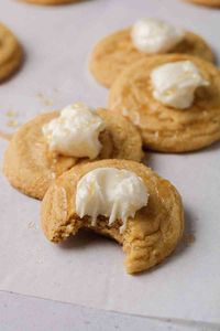 This CRUMBL inspired corn bread cookie is thick, soft, and chewy. Topped with a delicious honey buttercream for the perfect finish!