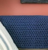 This chunky crochet blanket pattern is the epitome of comfort. It works up quickly and easily and makes a super comfy blanket to cuddle up with!  #crochet