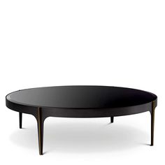 a black coffee table sitting on top of a white floor