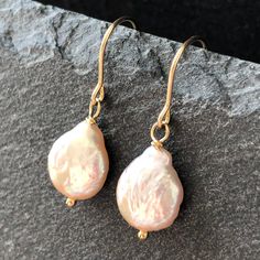 7379 These beautiful dangle drop earrings were meticulously handcrafted with pink freshwater pearls and gold filled components. Emanating elegance and style this pair will make perfect birthday, anniversary, appreciation or holiday gift for yourself or special woman in your life - mom, wife, girlfriend, daughter, sister, grandma, niece, aunt, cousin, best friend, teacher, coach, doctor, caregiver or colleague. MATERIALS & DIMENSIONS ✦ Freshwater PEARLS, blush pink, teardrops approx. 12x9mm; ✦ GO Fish Hooks Show, Pearls Earrings Gold, Cousin Best Friend, Pink Pearl Earrings, Pearls Earrings, Pink Pearls, Gold Pearl Earrings, June Birthstone, Birthday Gift For Her