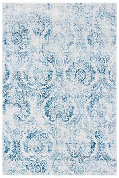 a blue and white rug with an ornate design on the bottom, it is very soft