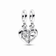 A meaningful charm to symbolize the unbreakable bond between mother and daughter. The Splittable Mother & Daughter Dangle Charm consists of two sterling silver dangle charms that fit together to create a heart shape in two halves, with a clear cubic zirconia stone at the center and a cut-out heart on the reverse side. One half of the charm is engraved with the word "MOTHER" and the other half with "DAUGHTER", so you can each wear one half as a reminder that the love you share is always there, even when you're apart - because you'll always have a piece of each other's heart. Heart Charms For Anniversary, Anniversary Heart Dangle Charms, Heart Dangle Charms For Anniversary, Heart Charm Dangle Charms For Anniversary, Silver Heart-shaped Dangling Charms, Silver Heart Shaped Dangling Charms, Silver Heart Charms With Dangling Details, Sterling Silver Heart Charms With Dangling Details, White Gold Heart Charm For Anniversary