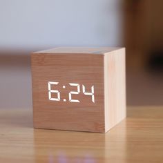 a wooden block with the time displayed on it