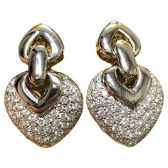 A classic pair of diamond earrings done in 14K white gold set with approximately 3cttw in G-H color Vs2-Si2 clarity round diamonds. Posts with omega backs. Dimensions/Weight: Earrings measure 1.25” x .75” and weigh 15.5g. Condition: All stones are secure and in perfectly wearable condition. E-CCZ White Gold Set, Back Drop, Gold Set, Pave Diamonds, Diamond White, Round Diamonds, Diamond Earrings, Jewelry Earrings, White Gold