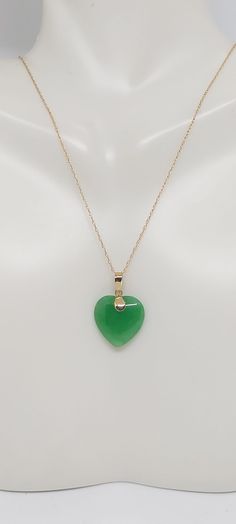 Heart Green Jade 14k Solid Yellow Gold Charm / Pendant / Necklace 18 Inches 14k ROPE Yellow Gold Chain. JADE HEART LOVER. Green Jade is the most admired gemstone by the Chinese. They consider it a symbol of the five virtues, which are modesty, courage, justice, wisdom, and compassion. These virtues are often carved into Green Jade stones. Green Jade birthstones are quite tough and are carved into unique and exquisite designs. Product Info: - Heart Stone: Green Jade. - Stone Color: Green. - Heart Jade Pendant Necklace Simple, Green Jade Heart Necklace, Ruby Jade Gold Necklace, Green 14k Gold Heart Jewelry, Green Heart-shaped 14k Gold Jewelry, Green 14k Gold Heart Pendant Necklace, Heart Stone, Green Heart, Jade Earrings