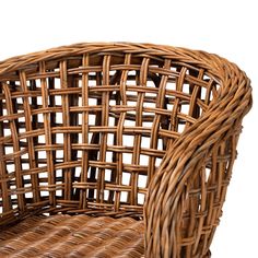 a brown wicker chair sitting on top of a white floor