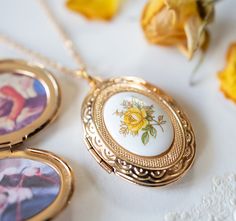 Yellow Rose Gold Oval Photo Locket. A lovely 30mm x23mm oval locket is adorned with a beautiful vintage Japanese floral porcelain cabochon (18mmx13mm) with yellow rose design. The locket is in gold finish with beautiful etched design on both front and back. The locket can open to hold two photos or small treasures. PERSONALISATION We can personalize this locket by adding 1 or 2 photos for you. You can also choose to add photo (s) on your own. Please choose the options from drop-down menu. How to Butterfly Locket Necklace, Rose Locket, Locket Gold, Miss You Gifts, Gold Locket Necklace, Add Photo, Photo Locket Necklace, Oval Locket, Heart Locket Necklace