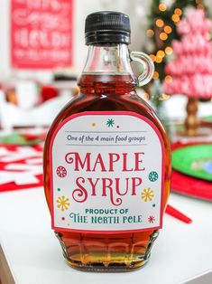 a bottle of maple syrup sitting on top of a table