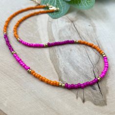 These delicate boho chic style necklace are great on their own or layered with other unique designs. Designed for everyday wear. T ♥ ITEM DETAILS: Total Length: Approx. 14 inches / 16 inches / 18 inches. The length of the necklace refers to the total length from end-to-end. Materials: Czech Glass Seed Beads. Color necklace available: Orange with Pink and gold. ♥ GIFT IT Jewelry comes in a cute Canva bag ready to gift! If you wish your item to be a gift, please let me know and I will include a cu Bohemian Necklace With Spacer Beads For Beach, Bohemian Beach Necklace With Spacer Beads, Bohemian Heishi Beads Necklace With Beaded Chain, Summer Multi-strand Colorful Beaded Necklaces, Bohemian Heishi Beads Choker As Gift, Bohemian Beaded Choker Necklace With Spacer Beads, Bohemian Style Beaded Choker With Spacer Beads, Heishi Beads Beaded Necklace For Summer, Festival Heishi Beads Necklace With Tiny Beads