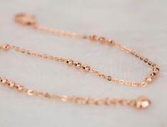 ♦ Handmade, high-quality item! ♦ Material: 14K Solid Rose Gold (18K Solid Rose gold is available to order) ♦Finish: High Polishing Finish ♦ Bracelet Length: 17.5cm + Adjustable chain 1.5cm (the listing photo) All of our jewelry is made to order, please allow the time for the production. 14k Rose Gold Tarnish Resistant Bracelets, Rose Gold 14k Tarnish Resistant Bracelets, Rose Gold Tarnish Resistant 14k Gold Bracelets, Dainty Rose Gold Bracelet For Gift, Rose Gold Diamond Cut Chain Bracelet, Fine Jewelry Rose Gold Bracelets In 14k Gold, Fine Jewelry Rose Gold 14k Bracelets, Delicate Adjustable Chain Bracelet In Rose Gold, Rose Gold Diamond Bracelet With Polished Finish