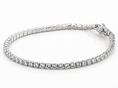 Pre-Owned Bella Luce ® white diamond simulant 9.58ctw round, rhodium over sterling silver bracelet. Measures approximately 7 1/4"L x 1/8"W and has a hidden box closure. The diamond equivalent weight is 6.16ctw..  This product may be a customer return, vendor sample, or on-air display and is not in its originally manufactured condition.  It may not be new.  In some instances, these items are repackaged by JTV. Classic Sterling Silver Bracelet With Sparkling Stones, Diamond White Sterling Silver Tennis Bracelet, Classic Sterling Silver Tennis Bracelet With Sparkling Stones, Sterling Silver Bracelet With Sparkling Stones, Classic Cubic Zirconia Bracelets With Sparkling Stones, Fine Jewelry Silver Tennis Bracelet With Diamond Accents, White Gold Sterling Silver Tennis Bracelet With Diamond Accents, Sterling Silver Tennis Bracelet With Brilliant Cut, Sterling Silver Tennis Bracelet With Sparkling Stones