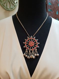 Very cool vintage bohemian necklace, probably from the 1960s Firstly, I believe the metal is 800 Silver (meaning 80% Silver, unlike Sterling Silver which is 92.5% Silver). It passes the magnet test and polishes up nice like Silver. Secondly, I believe the orange beads are simulated Coral; they look real, but are faux. Lastly, the "bells" dangling at the bottom are not true bells because there is no clapper inside them. But they do still make a nice *little* jingle when they move. This is a well-done necklace of this genre, kind of like the Goldilocks idea...just right. 2.75" long including the bells, and 2" across 28" long chain; no clasp just slip it over your head😊 You can wear it shorter by using a small safety pin or elastic in back👍 Not hallmarked Contact me with any questions Bohemian Chain Necklace With Adjustable Chain, Bohemian Round Chain Necklace With Adjustable Chain, Vintage Beaded Necklace With Adjustable Chain For Gift, Retro Metal Jewelry For Festival, Vintage Antique Silver Jewelry For Festivals, Vintage Handmade Necklaces For Festive Occasion, Vintage Beaded Chain Pendant Jewelry, Festive Bohemian Jewelry With Adjustable Chain, Vintage Beaded Chain Necklaces