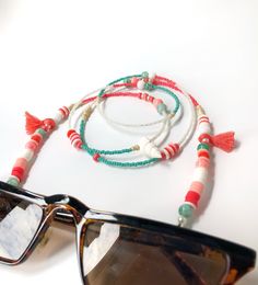 Handmade Beaded Glasses Chain,Seashell Sunglasses Strap, Eye Glass Holder,Boho Hippie Mask Chain,Summer Jewelry,Miyuki Seed Beads Lanyards If you are tired of playing hide and seek with your glasses and masks, there is a colorful news for you! Thanks to our handmade eyeglass straps, which make it almost impossible to lose glasses and give life to boring frames, you can wear your glasses comfortably by hanging them on your neck when not wearing them. It completes your full BOHO chic look! You can Beach Jewelry With Large Glass Beads, Bohemian Jewelry For Summer Beach Party, Adjustable Colorful Beaded Necklaces For Vacation, Hippie Beaded Necklaces For Beach, Adjustable Beaded Summer Jewelry, Large Beads For Summer, Summer Hippie Beaded Necklaces With Colorful Beads, Beach Season Jewelry With Beaded Chain, Adjustable Summer Jewelry For Beach