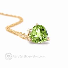 A lovely heart shaped Peridot necklace in 14K Gold.  This natural Peridot pendant has an 8mm heart cut green Peridot gemstone and comes in 14K White Gold, Yellow Gold or Rose Gold with a 16 inch, 18 inch or 20 inch 14K chain.  Gorgeously feminine!  This heart pendant would make a wonderful gift for an August birthday or push present.  Made to order.  Please allow 2 to 3 weeks for delivery. For more beautiful Peridot jewelry, click here: http://www.etsy.com/shop/RareEarth/search?search_query=peridot Official Website: www.RareEarthJewelry.com Fine Jewelry May Birthstone Heart Cut Necklace, Yellow Gold Heart Cut Jewelry For May Birthstone, Green Necklace With Heart Charm For Anniversary, Fine Jewelry Green Heart Jewelry, Green Heart Charm Necklace For Anniversary, Luxury Peridot Jewelry For Gifts, Green 14k Gold Heart Jewelry, Fine Jewelry Peridot Necklace For Anniversary, Green Peridot Jewelry For Gift