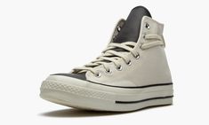 The Fear of God x Converse Chuck 70 Hi “Natural” is one of several versatile colorways of the high-top shoe imagined by the California based fashion brand.  Released as part of Fear of God’s Essentials line for Spring 2020, the Converse Chuck 70 Hi “Natural” incorporates an added lace loop on the heel of its design for a modern update on the timeless silhouette.  The upper features a thicker variety of vintage-inspired cream or “Natural” canvas, an upgrade built exclusively for the Chuck 70.  Me Natural Shoes, High Top Shoe, Converse Chuck 70, Stadium Goods, Naturalizer Shoes, Chuck 70, Fear Of God, The Fear, Cream Lace