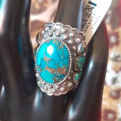 Nwt Beautiful #Sterling Silver Kingman Turquoise Cabochon Ring. Smaller Turquoise Sets Lining Each Side Of Ring. Ornate Southwestern Detailing. Size: 7 Materials: Sterling Silver .925 Copper Matrix Kingman Mine Turquoise Thank You For Stopping By My Closet. Please Ask Me Any Questions You May Have & Happy Poshing! :) Southwestern Style Large Turquoise Ring For Anniversary, Southwestern Style Large Stone Turquoise Ring For Anniversary, Adjustable Oval Western Style Turquoise Ring, Handmade Silver Turquoise Ring In Western Style, Western Style Gemstone Ring, Western Style Turquoise Ring, Western Style Concho Rings As A Gift, Nickel Free Round Southwestern Turquoise Ring, Western Style Silver Gemstone Jewelry