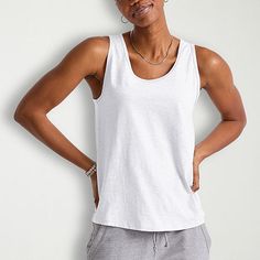 Basics that are far from basic. This cute and comfortable women's tank will get you from here to there in style with ease. Made with recycled polyester, so it's lightweight and has that soft-to-the-touch feel you know and love. A roomy fit that can be dressed up or down. Quality-wise, this tank does the most! Banded collar, armholes, and double-needle stitching on the hem for a fit that won't quit. Grab a few in our basic colors and beef up your staples with these tank tops for women by Hanes originals.Be yourself in Hanes originals - a stylish collection of cool, modern essentials designed for comfort, made for every body.Soft & comfy feel - our best cotton, polyester, and rayon come together to make this soft and comfy women's tank top.Made from recycled materials - made with recycle Relaxed Fit Tank Vest Top, Casual Tank Strap Tops For Loungewear, Basic Everyday Tops With Tank Straps, White Casual Tank Top For Loungewear, Casual White Tank Top For Loungewear, Everyday Racerback Tops For Summer, Racerback Tops For Everyday Summer Wear, Cotton Scoop Neck Tank Top For Gym, Solid Everyday Tank Tops