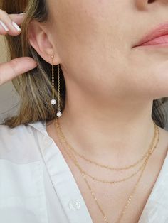 The sparkle on these double chain Pearl earrings could light up even the darkest room! Two natural Pearls swing on shimmery chain from each tiny stud. The earring post may be removed to wear on other stud earrings! ✨Details✨ * 3mm 14K Gold Filled or 925 Sterling Silver ball stud and accents * 2.75 inch length * 5mm genuine Pearls * 14/20 gf or 925 stamp for authenticity * Made with all hypoallergenic materials 🤍 * Sold as a pair Matching Necklace: https://etsy.me/42AkSCC ✨ Shop all Pearl earrin 14k Gold Dangle Pearl Earrings, Delicate White Earrings With Adjustable Chain, Everyday Round Pearl Chain Earrings, White Jewelry With Long Drop And Adjustable Chain, White Dangle Threader Earrings With Adjustable Chain, White Adjustable Chain Dangle Threader Earrings, White Delicate Chain Drop Earrings, Delicate Pearl Chain Drop Earrings, Delicate Linear Pearl Chain Drop Earrings