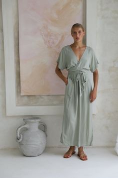 Chic Flowy V-neck Wrap Dress, Summer Viscose V-neck Wrap Dress, V-neck Viscose Dresses For Loungewear, Chic V-neck Rayon Maxi Dress, Elegant V-neck Midi Dress With Elastic Waistband, Feminine Rayon V-neck Midi Dress, Flowy V-neck Midi Dress For Loungewear, V-neck Rayon Midi Dress With Tie Waist, Chic Rayon Loungewear Dress