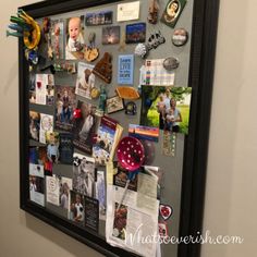 a bulletin board with pictures and magnets on it in the corner of a room