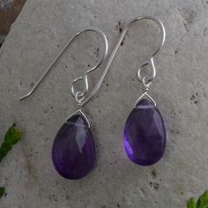 Dark Purple Amethyst Earrings handmade with fine African Amethyst faceted pear-shaped gemstones and 925 Sterling Silver. ✤GEMSTONE SIZE: 10 x 8 MM approximate ✤LENGTH OF EARRINGS: 1.20 inches long It is also believed that the Amethyst has healing powers to help with physical ailments, emotional issues, and in Energy Healing and Chakra balancing. Amethyst crystal therapies are primarily associated with physical ailments of the nervous system, the curing of nightmares and insomnia, and balancing t Purple Sterling Silver Teardrop Dangle Earrings, Amethyst Earrings For Gift, Handmade Amethyst Teardrop Crystal Earrings, Lavender Gemstone Earrings For Gifts, Purple Pierced Crystal Earrings As Gift, Gift Briolette Crystal Earrings, Purple Sterling Silver Teardrop Earrings For Gift, Handmade Amethyst Teardrop Earrings, Purple Long Drop Earrings As Gift