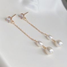 * DETAILS * This listing is a pair of earrings only.  - Freshwater Pearl - 14K Gold Plated CZ Post Earrings  - 14K Gold Plated Chain 👉🏻For more earrings, see https://www.etsy.com/shop/JinnysJewelryBySeJin ✨matching earrings. https://www.etsy.com/JinnysJewelryBySeJin/listing/1259483823/freshwater-pearl-earrings-bridal?utm_source=Copy&utm_medium=ListingManager&utm_campaign=Share&utm_term=so.lmsm&share_time=1656461065010 👉🏻You may also like matching necklace. https://jinnysjewelrybysejin.etsy.c Gold Hypoallergenic Linear Earrings For Anniversary, Graceful Dangle Bridal Earrings For Gift, Graceful Dangle Jewelry For Anniversary, Elegant Yellow Gold Crystal Earrings For Anniversary, 14k Gold Dangle Bridal Earrings As Gift, Anniversary Bridal Earrings With Pearl Drop In Yellow Gold, Anniversary Yellow Gold Bridal Earrings With Pearl Drop, Anniversary Bridal Earrings In Yellow Gold With Pearl Drop, Graceful Yellow Gold Wedding Earrings