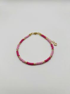 Dainty pink glass seed bead bracelet with light and dark pink and gold-filled accents. Perfect for stacking or on its own!  Adjustable 7-8". Glass Seed Bead Bracelet, Pink Beaded Bracelet, Pink Beaded Bracelets, Seed Bead Bracelet, Light And Dark, Seed Bead Bracelets, Pink Bracelet, Bracelet For Women, Pink Glass