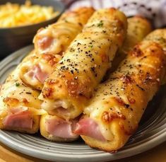 some ham and cheese rolls on a plate