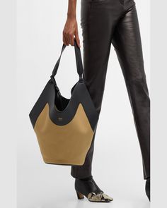 "Find KHAITE Lotus Tote Bag on Editorialist. The Khaite \"Lotus\" tote bag is crafted from leather, canvas cotton, and vegan leather. The bag features a shoulder strap, open top, and an interior, removable zip pouch bag. The bag measures approximately 15.5\"H x 22\"W x 8.5\"D. It is made in Italy." Luxury Hobo Bag Tote With Removable Pouch, Luxury Versatile Hobo Tote Bag, Luxury Suede Hobo Tote Bag, Khaite Lotus Bag, Khaite August Hobo, Black Honey, Medium Tote, Zip Pouch, Open Top