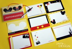 mickey mouse notepads are arranged on a yellow surface with red and black accents