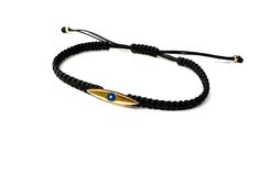 Handmade braided bracelet cord with Eye charm. Bracelet for men. Materials: 🔹 24k gold plated charm/ Enamel eye 🔹 Waterproof String 🔹 Finished with a sliding knot closure, adjustable size bracelet All items are handmade with love just for you! 🔹 Check out our shop for more jewellery https://www.etsy.com/shop/JustSeedBeads?ref=seller-platform-mcnav§ion_id=23857241 Thank you! Bracelet Cord, Sliding Knot Closure, Bracelet Evil Eye, Braided Bracelet, Sliding Knot, Gold Gift, Bracelet For Men, Braided Bracelets, Bracelet Gold