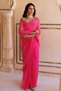 Hot pink chiffon saree, handcrafted with resham and tube work in floral patterns and embellished with golden spray. Comes with a unstitched blouse piece.
Components: 2
Pattern: Hand Embroidered
Type Of Work: Resham, Tube Work
Fabric: Chiffon
Color: Pink
Other Details: 
Length of saree: 5.5 mtrs
Approx. product weight (in gms): 200
Note: Stitched blouse worn by the model is not for sale
Disclaimer: Since these products are handcrafted and hand dyed, hence may have slight irregularities and dissim Festive Silk Chiffon Pre-draped Saree, Festive Silk Chiffon Saree Blouse Piece, Traditional Chiffon Pre-draped Saree For Eid, Traditional Chiffon Pre-draped Saree For Diwali, Festive Silk Chiffon Saree, Eid Georgette Blouse With Sheer Dupatta, Eid Sheer Dupatta Georgette Blouse, Traditional Silk Chiffon Saree For Festive Occasions, Festive Traditional Silk Chiffon Saree