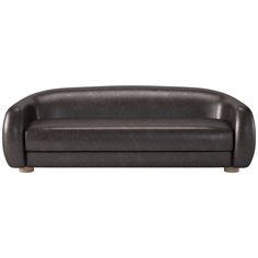 a black leather couch sitting on top of a white floor