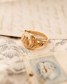 The Marie Antoinette Ring her monogrammed rIng MA, she was the queen of France brfore the French Revolution. This beautiful ring made of 18k gold plated silver and inscribed inside Eat Cake. Vintage Gold Initial Ring Stamped 14k, Gold Oval Initial Ring Stamped 14k, Timeless Gold Signet Ring With Hallmarks, Timeless Gold Initial Ring For Promise, Timeless Gold Initial Promise Ring, Heirloom Engraved Ring Jewelry, White Gold Monogram Rings For Wedding, Monogrammed White Gold Rings For Wedding, Timeless Gold Monogram Jewelry