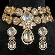 Polki Necklace, inspired by Sabyasachi, features Moissanite and Kundan diamonds set in uncut Polki with a delicate design. Rose gold-plated for a touch of elegance, it embodies a blend of traditional and modern aesthetics. Ideal for bridal jewelry, it adds a sophisticated, faux diamond sparkle to any ensemble. *𝐏𝐑𝐎𝐃𝐔𝐂𝐓 𝐃𝐄𝐓𝐀𝐈𝐋* * Material: Brass * Plating: Rose Gold Plated * Stone: Semi Precious Polki, Kundan & CZ.  *𝐃𝐈𝐌𝐄𝐍𝐒𝐈𝐎𝐍𝐒* * Necklace- Weight: 68 gm,  Design Length-6.3 Glamorous Kundan Jewelry For Wedding, Glamorous Festive Jewelry For Reception, Elegant Heavy Kundan Necklace For Party, Luxury Kundan Necklace With Stone Work For Celebration, Formal Kundan Necklace With Cutdana For Festive Occasions, Festive Formal Kundan Tikka, Formal Festive Bridal Chandbali Necklace, Elegant Wedding Choker For Festivals, Luxury Kundan Necklace For Festive Party