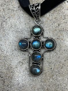 Brilliant antique Rainbow Labradorite cross Lovely handmade silver work Silver About an inch and a half long All jewelry is shipped in a nice gift box. Check out our over a THOUSAND great reviews Handmade Silver Cross Pendant Necklace, Handmade Silver Necklace With Cross Pendant, Bohemian Cross Pendant Jewelry Gift, Handmade Spiritual Cross Pendant Jewelry, Spiritual Handmade Cross Pendant Jewelry, Spiritual Crucifix Gemstone Jewelry, Bohemian Sterling Silver Cross Jewelry, Unique Sterling Silver Cross Necklace, Handmade Silver Cross Pendant Jewelry