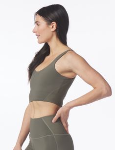 High Stretch Tops With Built-in Padding For Pilates, Functional Tops With Built-in Padding And 4-way Stretch, Functional Compressive Crop Top With Built-in Bra, High Stretch Racerback Activewear With Removable Bra Pads, Fitted Racerback Activewear With Removable Bra Pads, Compressive Racerback Activewear With Removable Bra Pads, Compression Yoga Top Bra Friendly, Yoga Compression Top With Bra Friendly Design, Fitted Athleisure Crop Top With Removable Bra Pads