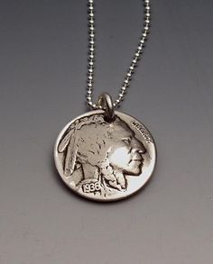 Pendant made from a vintage American Buffalo Nickel coin (the Indian is on the reverse side of the Buffalo, and the Indian is the front of this pendant). Year may vary. This pendant comes on a sterling silver bead chain. Please select length from the drop-down menu. Thanks for looking. Enjoy! American Buffalo, Buffalo Nickel, Coin Ring, The Buffalo, Adult Crafts, Us Coins, Bead Chain, Silver Bead, Sterling Silver Bead