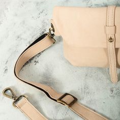 This Beige Leather Fanny Pack is the ideal bag if you like carrying all your necessities, keep your hands free and look effortlessly fashionable at the same time! Perfect for festivals, markets and travelling. Simple and beautiful bag made of a high quality Italian leather, which is soft to touch, strong, durable and a very fine material. Top grade thicker leather is used for the adjustable belt. This hip bag features one separate compartment closed by a zipper in the back and another zippered p Adjustable Crossbody Bags For On-the-go, Beige Crossbody Belt Bag For On-the-go, Rectangular Bag Strap With Removable Pouch For Daily Use, Beige Shoulder Bag With Adjustable Handle For On-the-go, Travel Crossbody Bag With Adjustable Strap, Versatile Adjustable Shoulder Bag For On-the-go, Trendy Mobile Phone Bag Strap For Everyday Use, Rectangular Beige Belt Bag For On-the-go, Adjustable Leather Bag For On-the-go