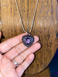 Beautiful vintage style beautiful purple Quartz stone heart necklace. In stirling silver. Has black CZ diamonds all over the charm. Unique item, very antique looking necklace. One of a kind. Silver Gothic Heart Charm Necklace, Gothic Silver Heart Pendant Necklace, Gothic Silver Heart Charm Necklace, Silver Gothic Heart Necklace, Silver Gothic Necklace With Heart Charm, Gothic Silver Necklace With Heart Charm, Metal Pendant Necklace For Memorial, Metal Pendant Necklace For Memorials, Vintage Silver Necklace With Heart Charm