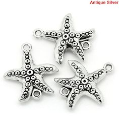 three starfish charms on a white background